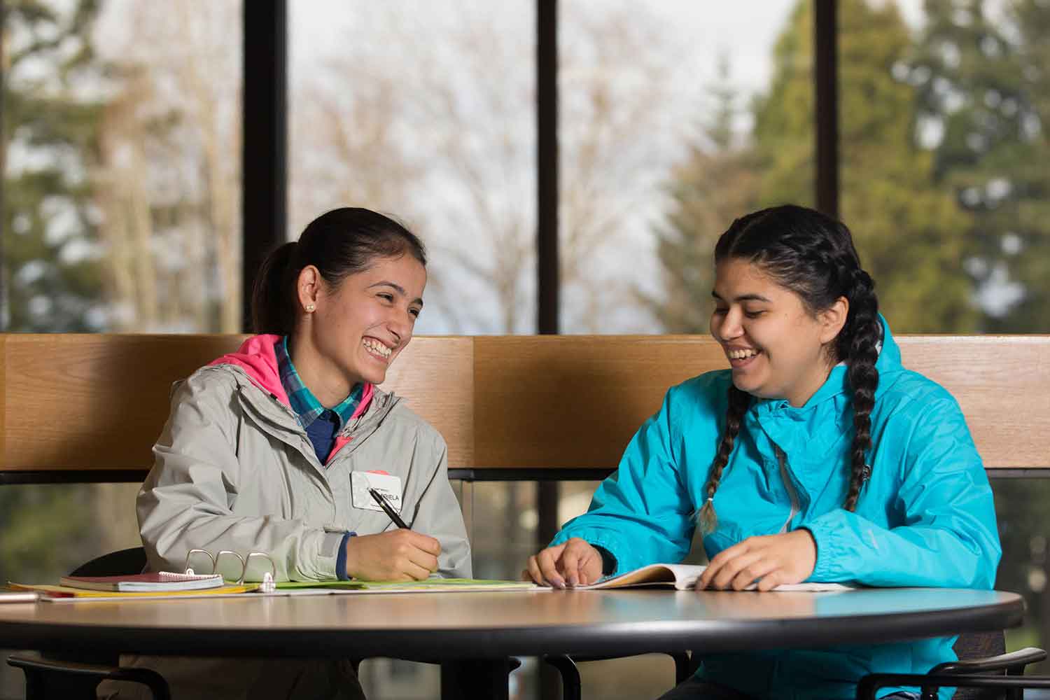 Two women do homework together