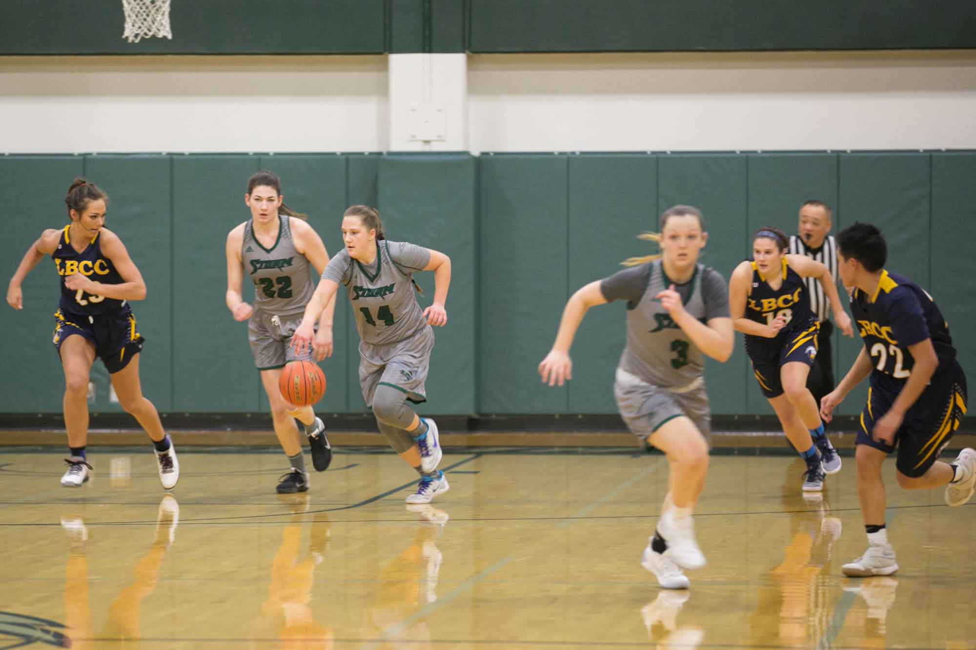 The Storm women's basketball team moves down the court