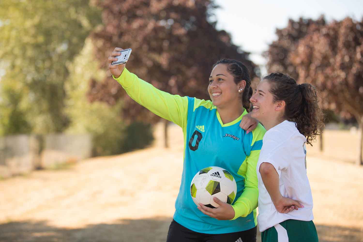 Two women soccer players taking a selfie