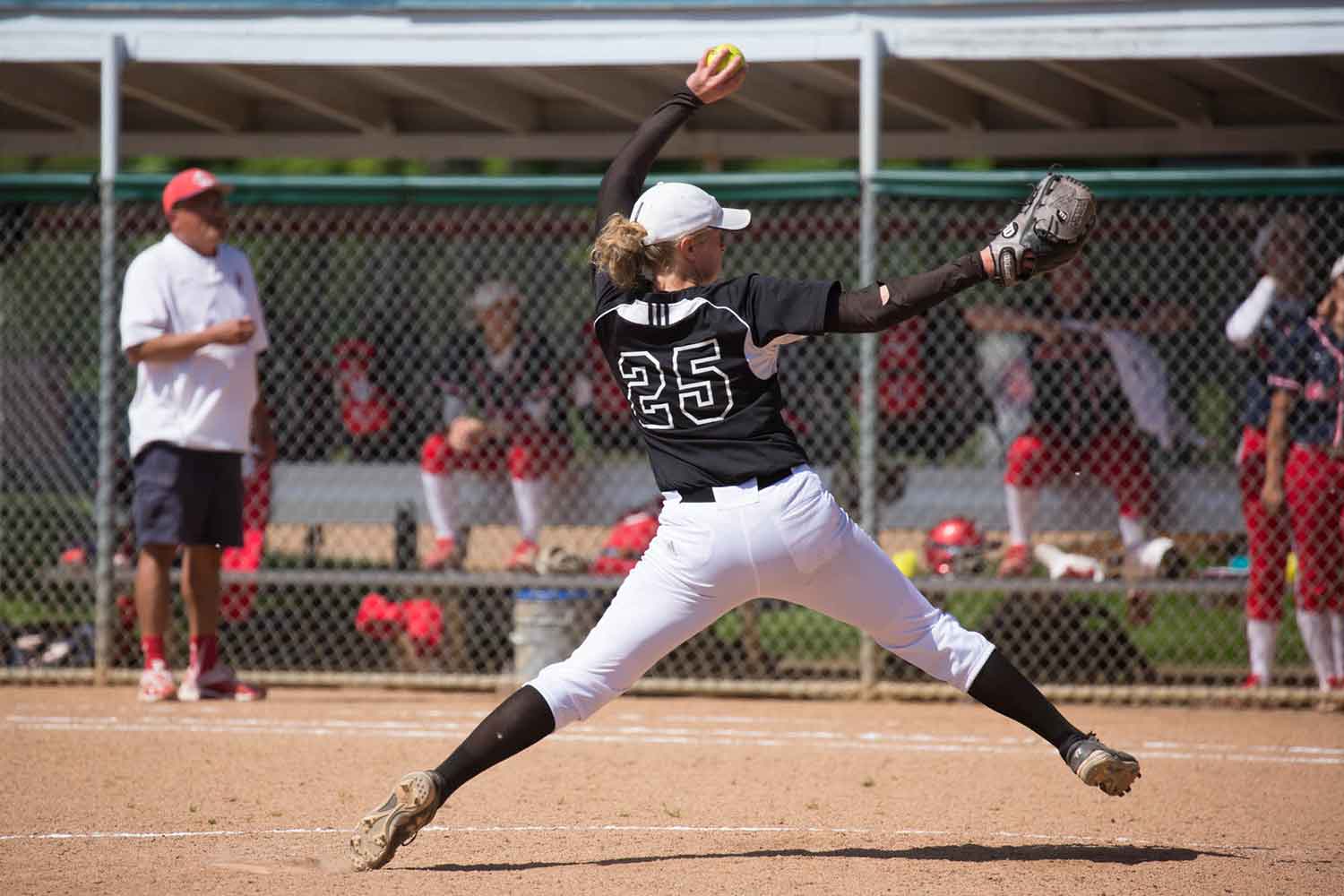 Women's softball pitcher in action