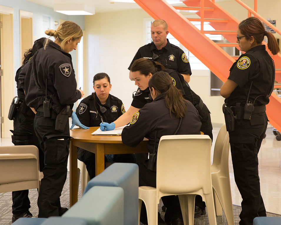 Corrections students meeting in a group