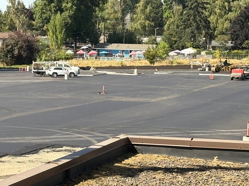 A parking lot in the process of being repaved.