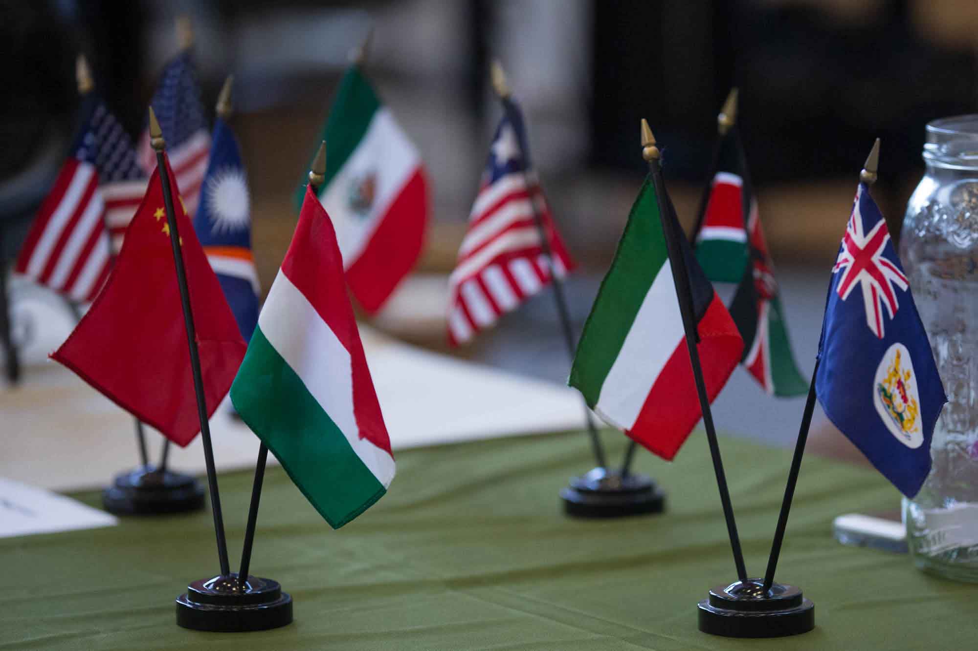 Tiny international flags decorate a table